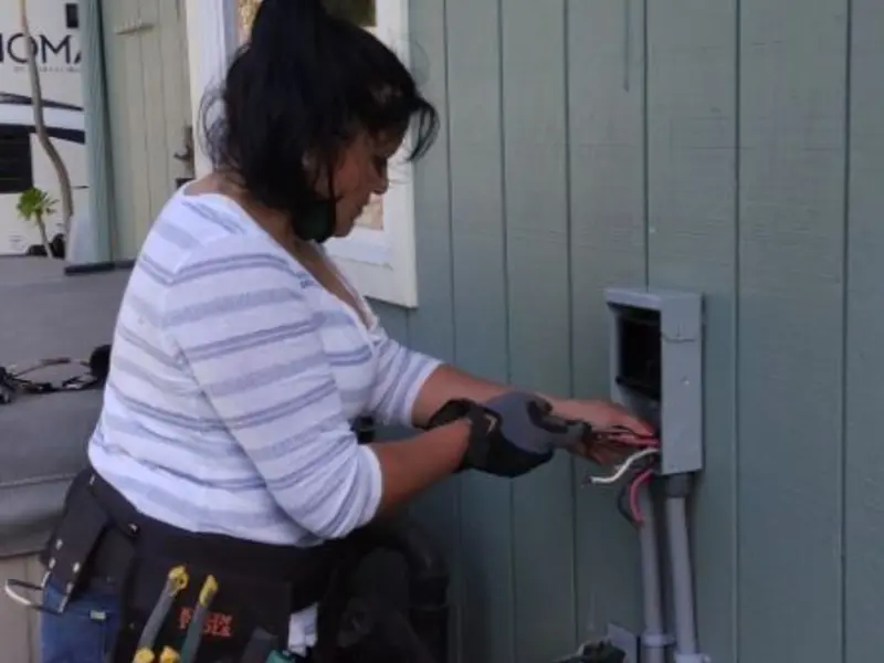 Licensed electrician wiring an exterior subpanel in Nephi