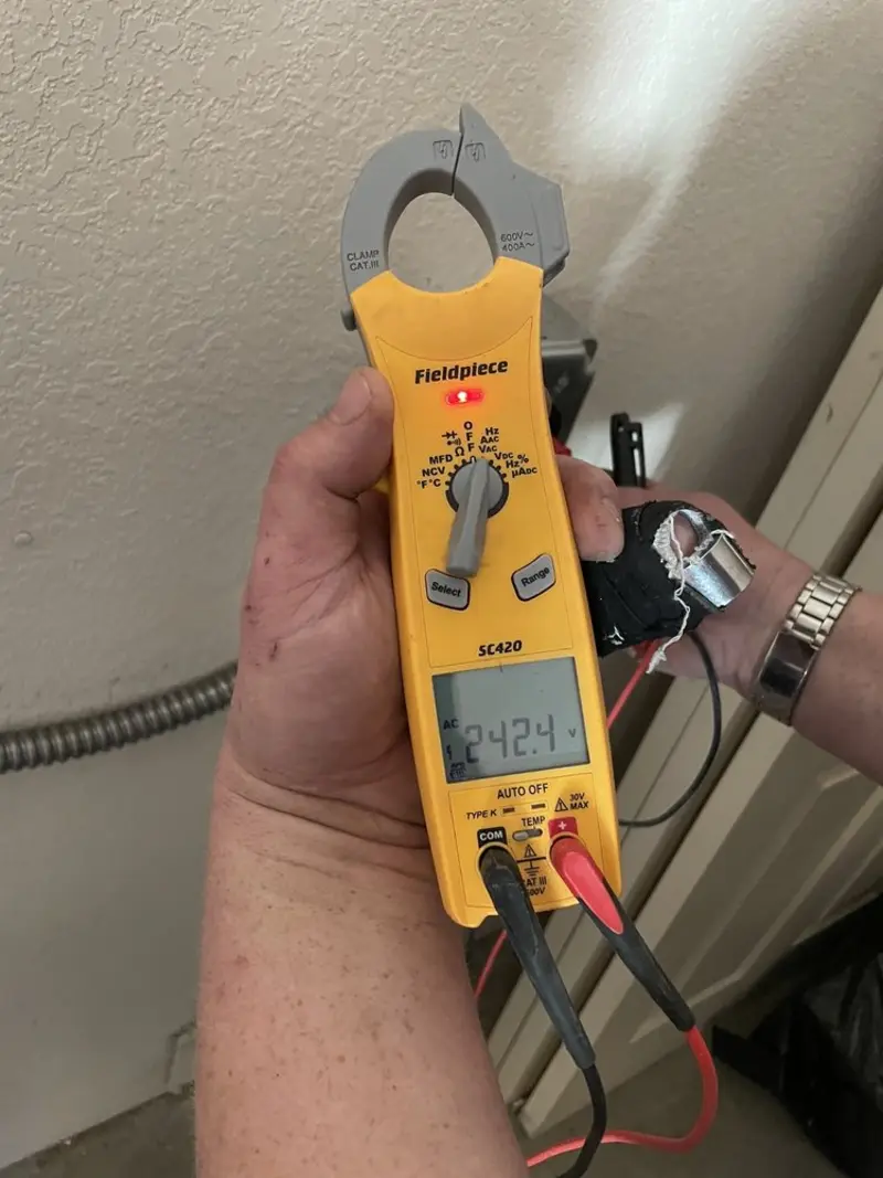 Voltage testing with clamp meter during Electrical Installation Services in Nephi